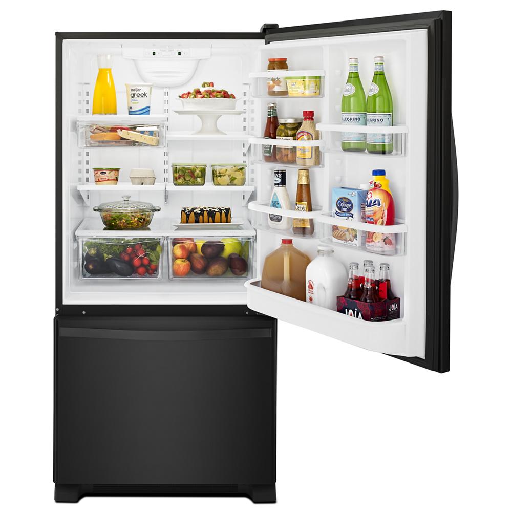 Black bottom-freezer refrigerator open to reveal organized interior with SpillGuard™ glass shelves in appliances and kitchenware collection
