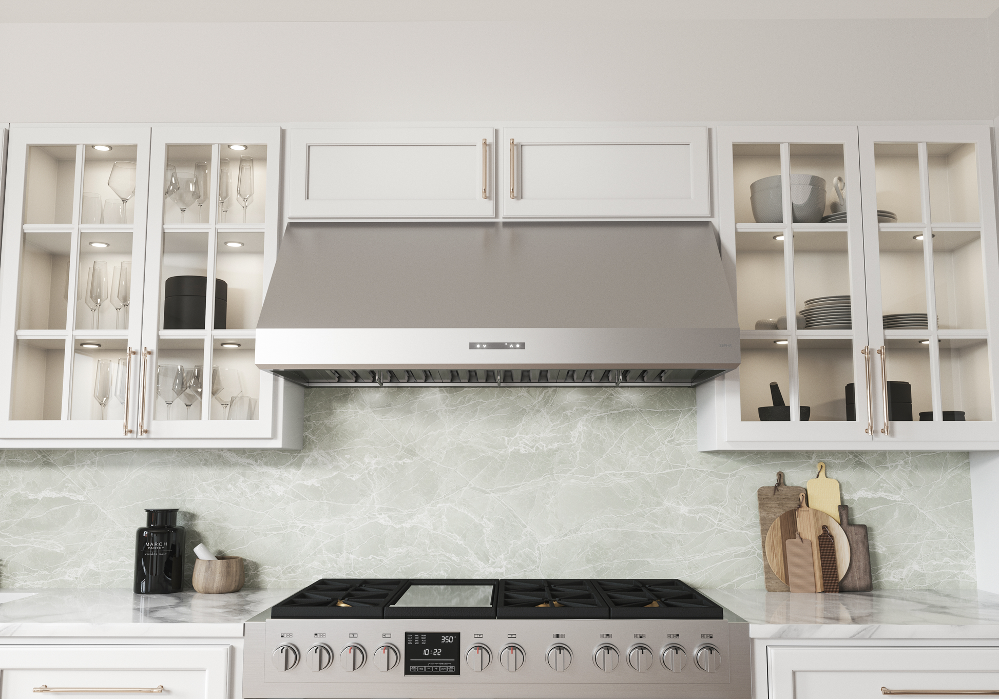 Stainless steel wall-mounted range hood with LED lighting installed above a gas stove surrounded by white cabinetry and glass-front kitchen cabinets, part of Wall Mounted Range Hoods and Kitchen & Kitchenware collections.