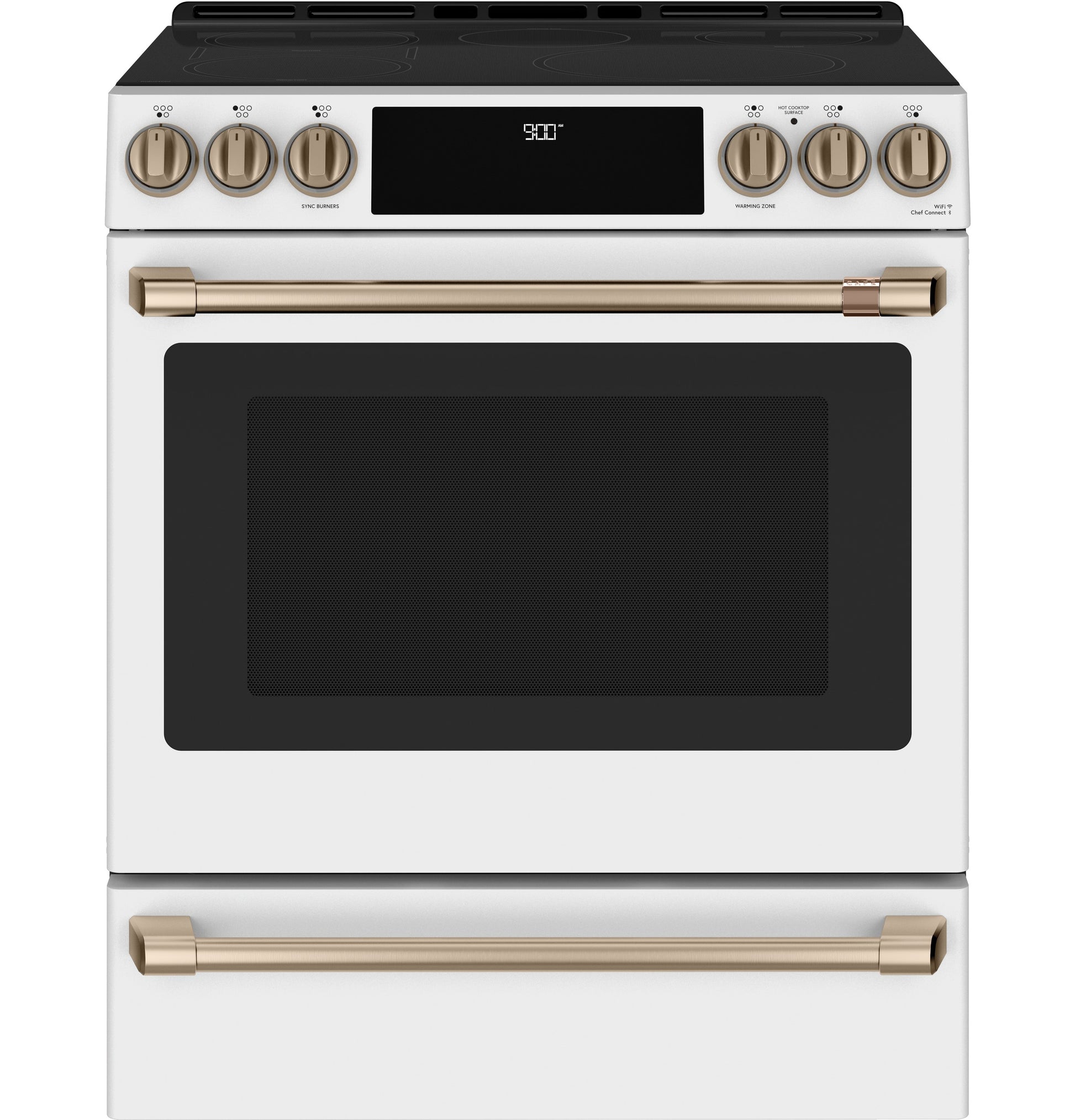 Front view of white slide-in induction and convection range with gold-tone handles and control knobs in kitchen collection