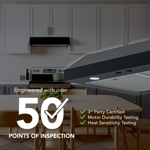Under-cabinet range hood with sleek black finish in modern kitchen featuring white cabinetry and wood dining table