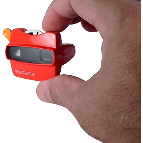 Hand holding a miniature red Viewmaster toy with an image reel in toys and pretend play collection