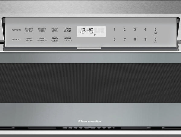 Stainless steel microwave drawer control panel with digital display and touchpad in kitchen appliances collection