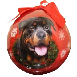 Red Christmas ball ornament featuring a rottweiler dog portrait with wreath and snowflake accents