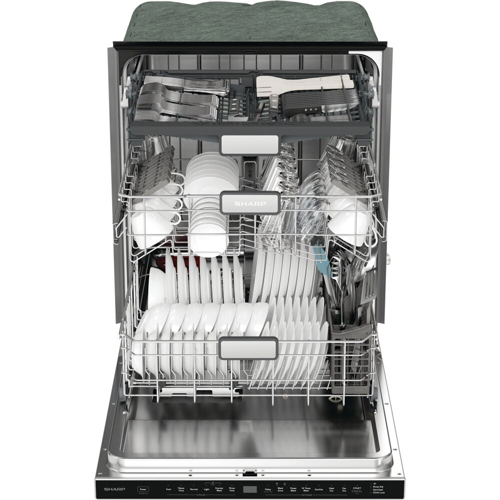 Open stainless steel dishwasher with three racks loaded with white dishes and utensils in kitchen appliances setting