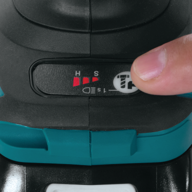 Close-up of finger adjusting speed settings on teal and black cordless impact wrench for tools and home improvement tasks