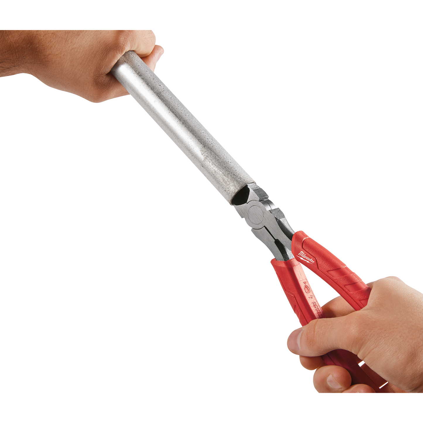 Red comfort grip diagonal cutting pliers cutting through a metal pipe for home improvement tasks