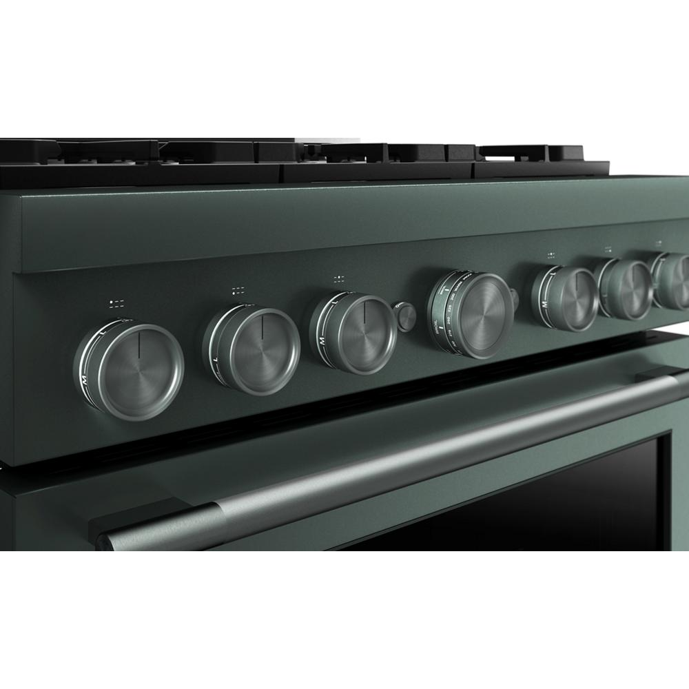 Close-up of dark green commercial-style gas range control panel featuring six metal knobs and a long stainless steel handle
