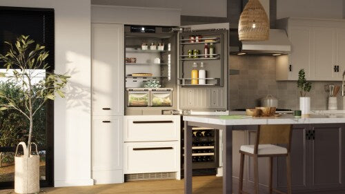 Built-in refrigerator freezer with glass shelves, illuminated interior, and bottom freezer drawers in kitchen appliances collection