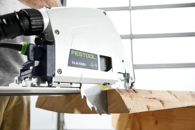 Festool plunge cut track saw cutting wood board with precision for power tools and home improvement projects