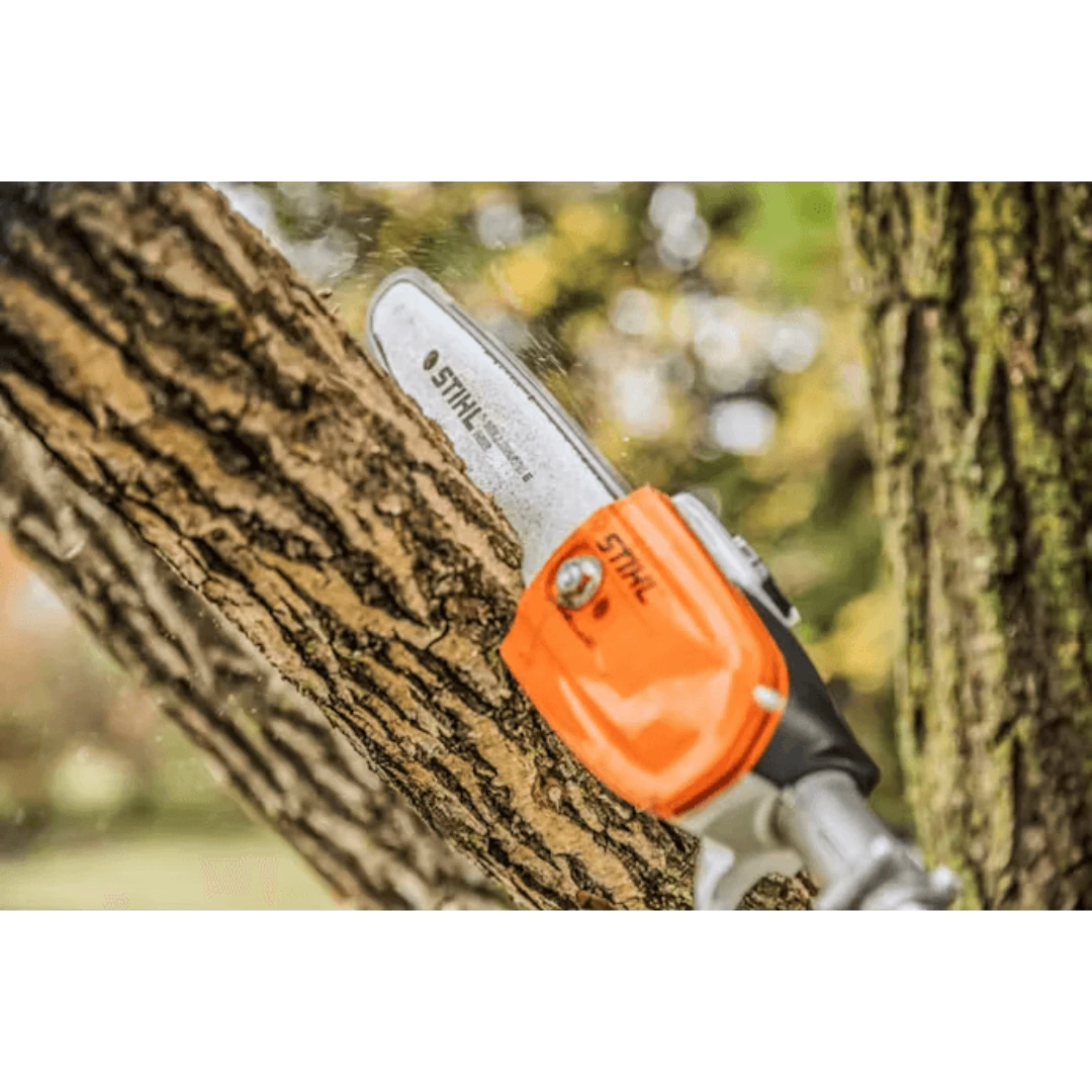 Close-up of orange pruning saw cutting a thick tree branch for home improvement and gardening tasks