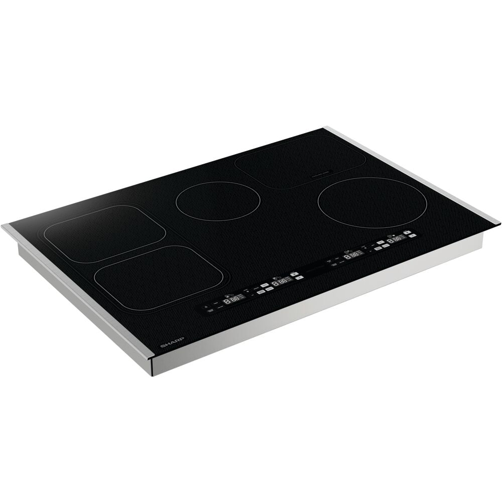 Black glass induction cooktop with four heating areas and touch controls in kitchen appliances and cooktops collection
