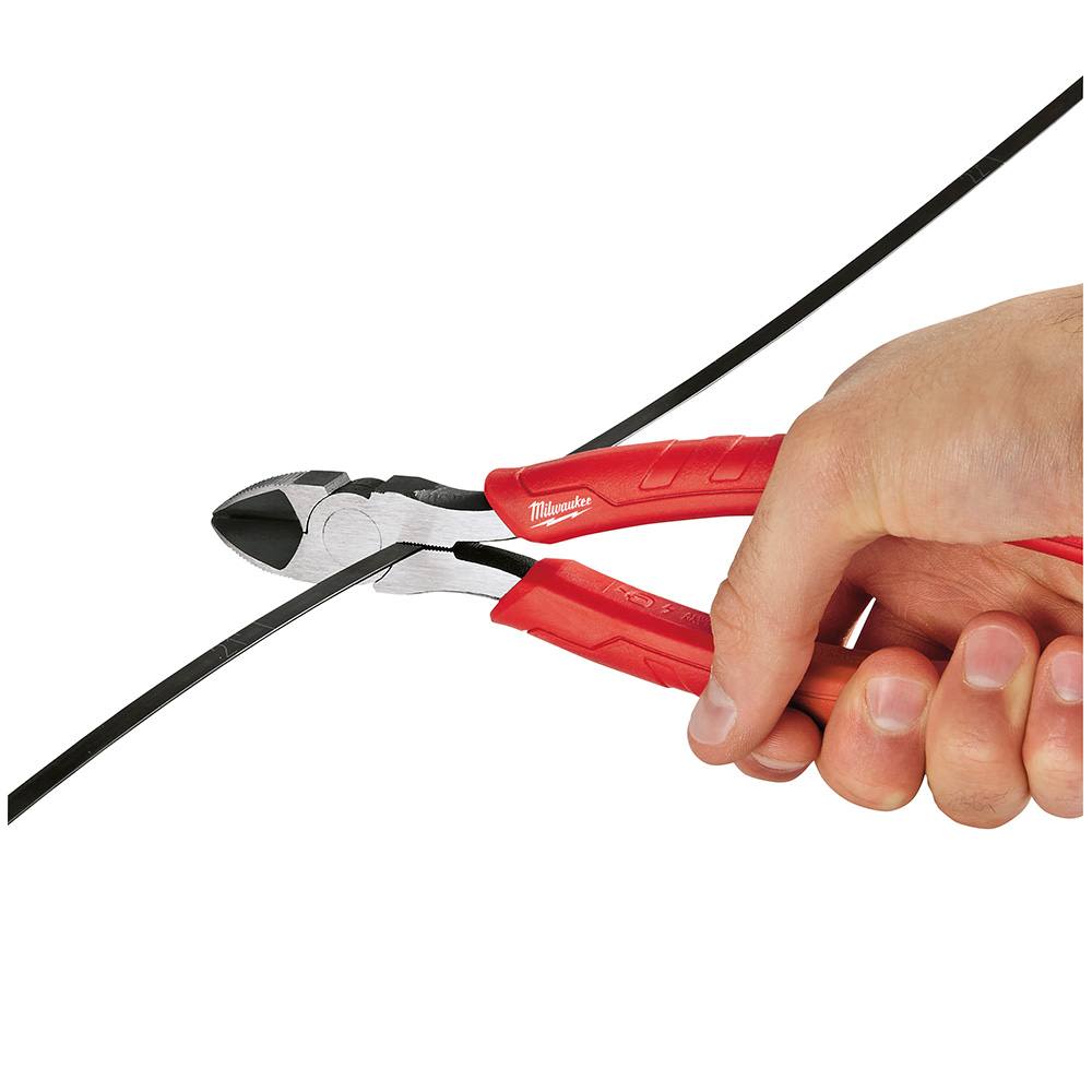 Hand gripping red comfort grip diagonal cutting pliers cutting a black wire for precise home improvement tasks