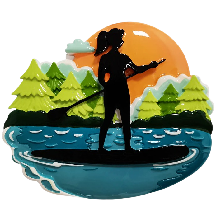 Female silhouette paddle boarding on lake with pine trees and orange sunset in Christmas Ornaments & Tree Decorations collection