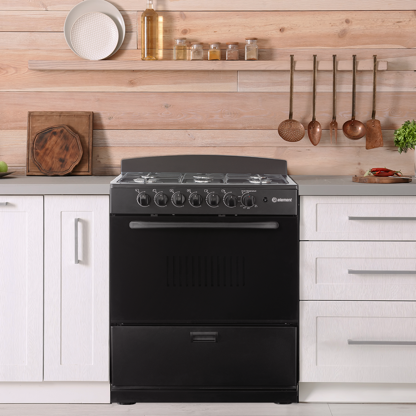 Black freestanding 30-inch gas range with six control knobs, spacious oven door, lower drawer, and stainless steel cooktop, shown in modern kitchen with wooden wall and white cabinetry, suitable for Ranges, Gas Ranges, Kitchen & Kitchenware, All Products, Appliances, and Ranges & Cooktops collections.
