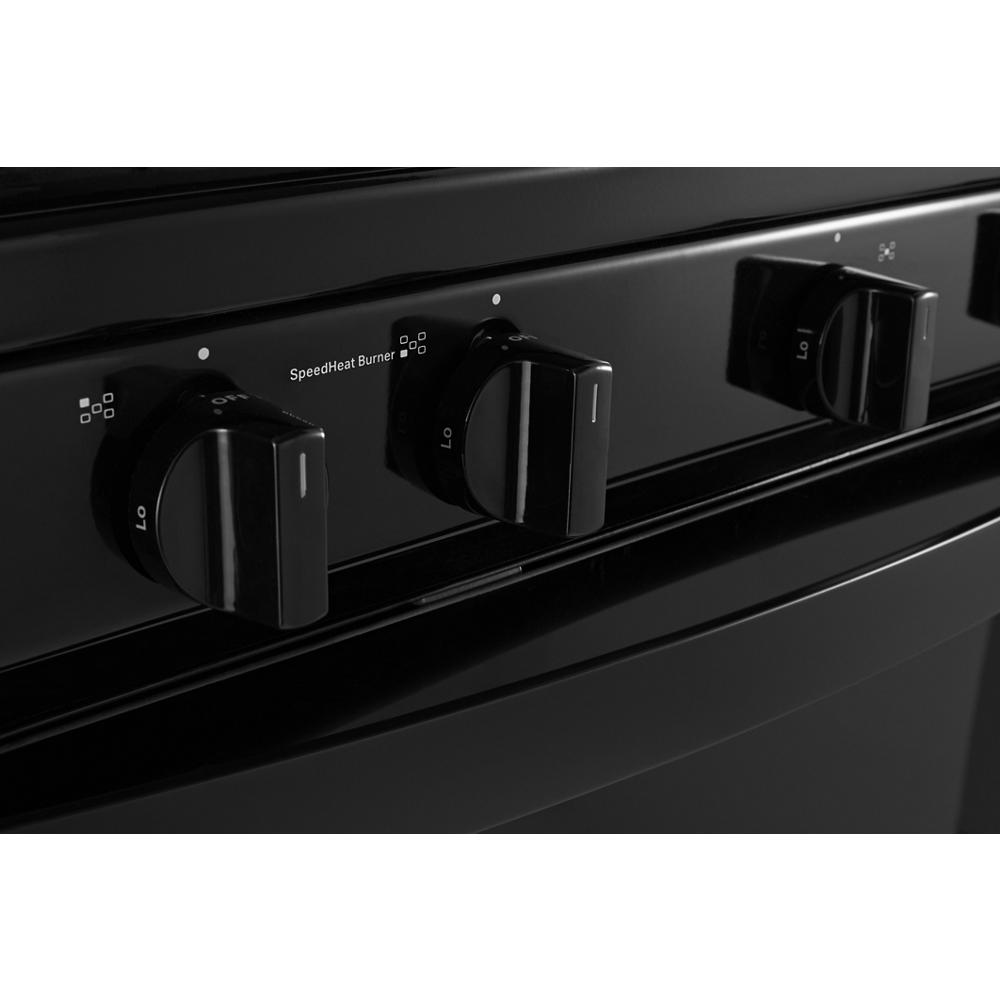 Close-up of black control knobs on a freestanding gas range for kitchen and home improvement collections