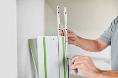 Person installing Festool guide rail accessory from woodworking tool accessories and power tool accessories collections