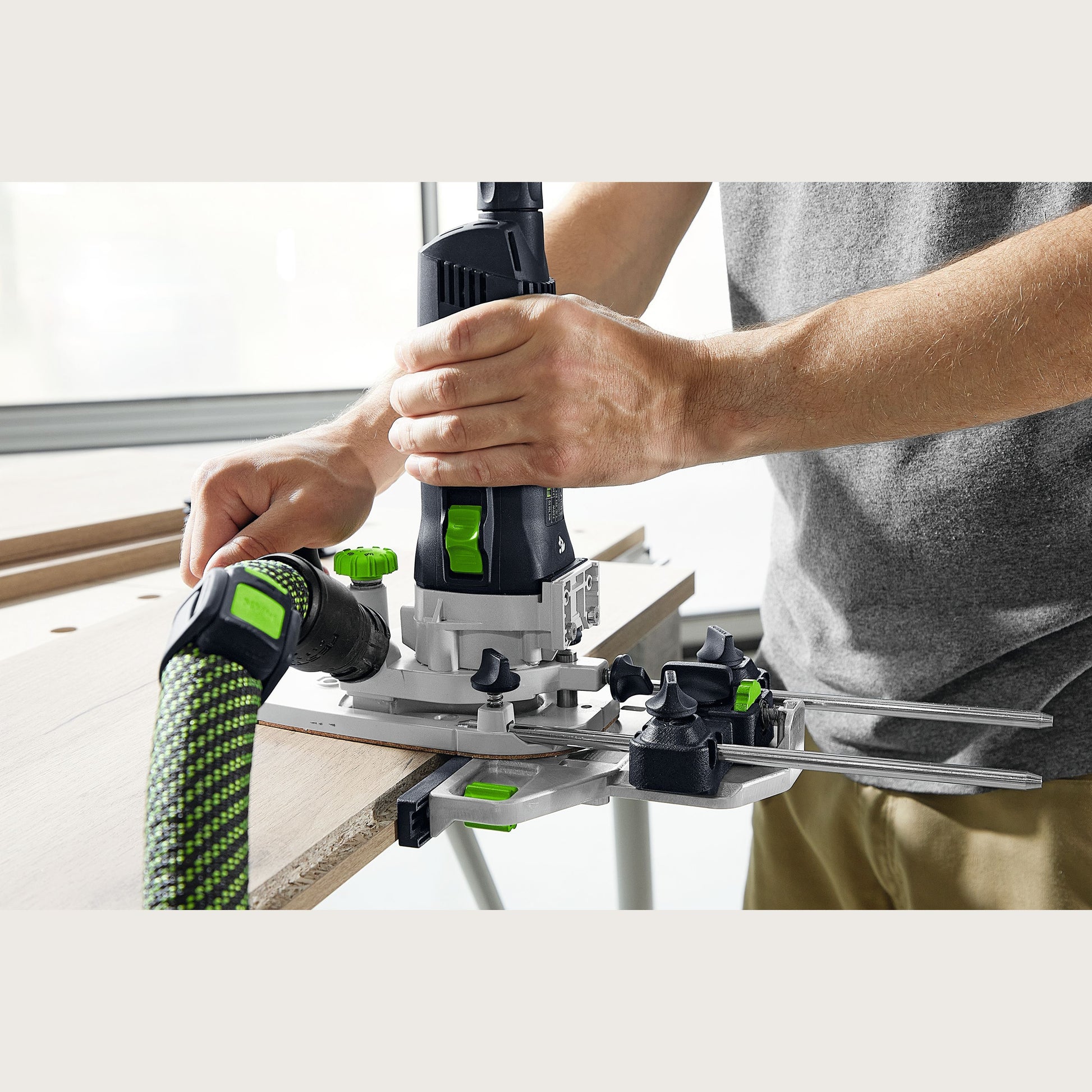 Person using a Festool edge guide with dust extraction on wood, woodworking tool accessory in under $100 collection