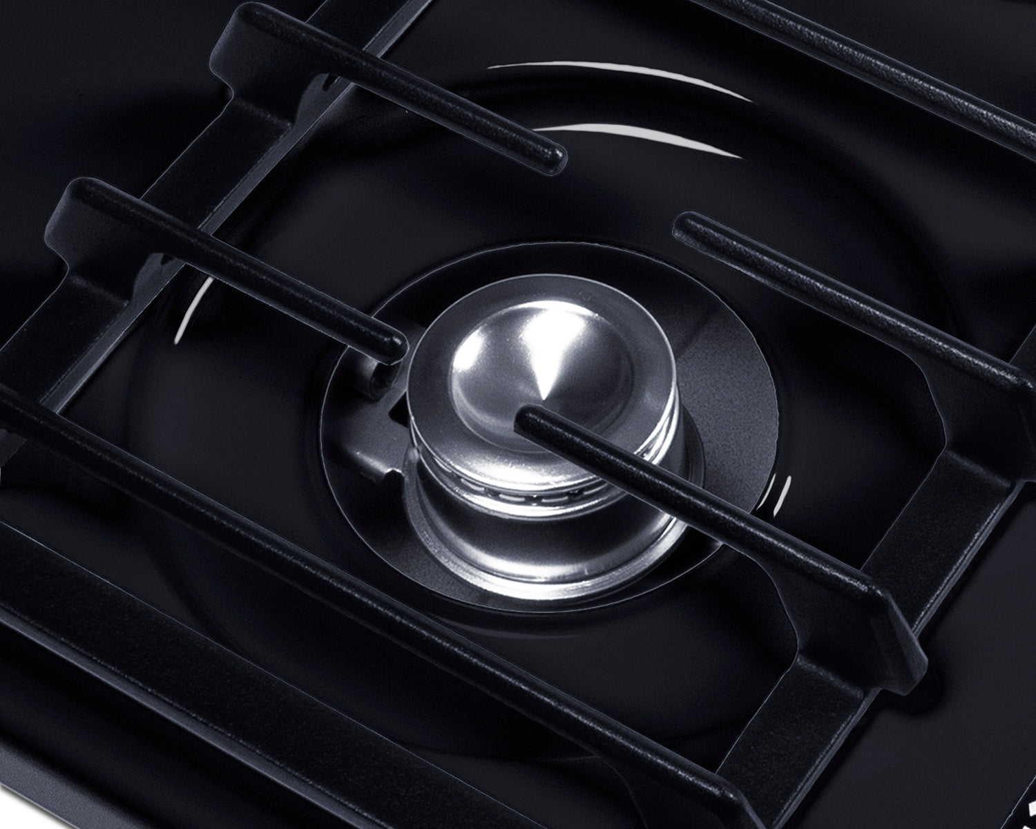 Close-up of a single burner with a shiny silver gas cap and black cast iron grate, featured in Cooktops, Gas Cooktops, and Kitchen & Kitchenware collections.