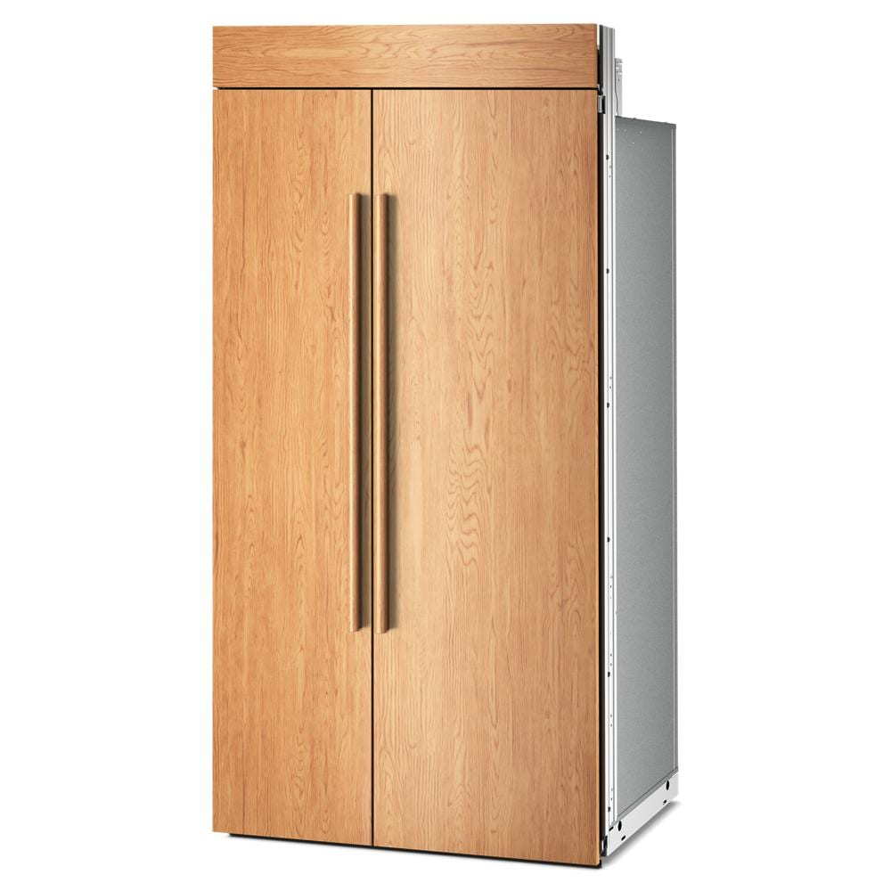 Built-in side-by-side refrigerator with panel-ready wood exterior and vertical handles, offering customizable installation options, part of KitchenAid appliances at Hartville Hardware.