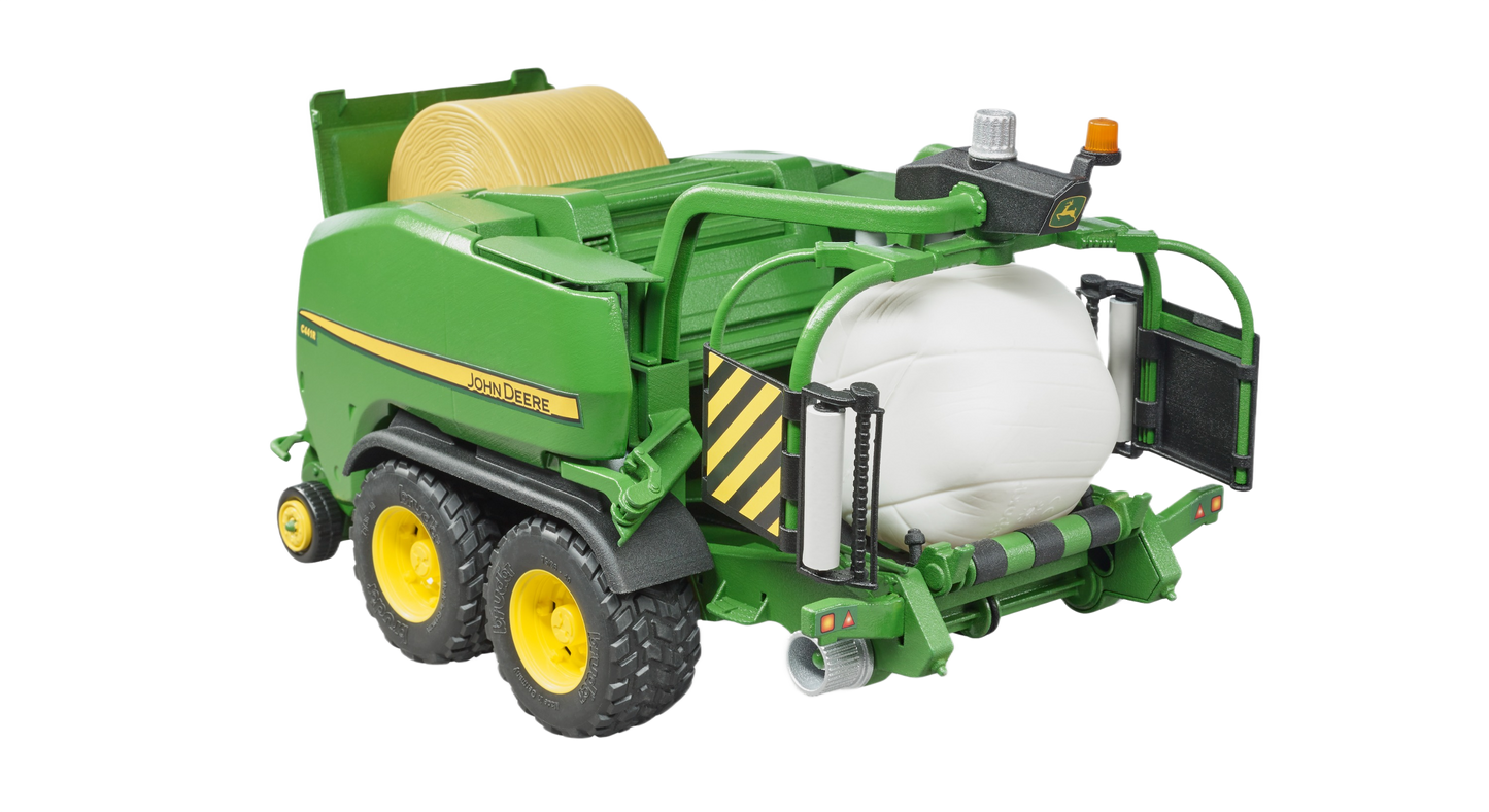 Green Bruder toy wrapping chamber baler with yellow wheels and large white bale from Vehicles & Remote Controlled Toys collection