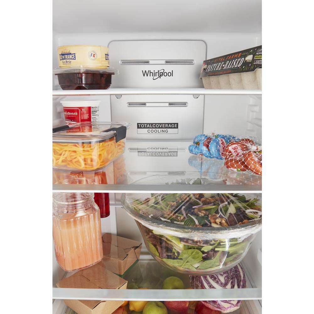 Interior view of organized groceries inside a Whirlpool bottom-freezer refrigerator from kitchen appliances collection