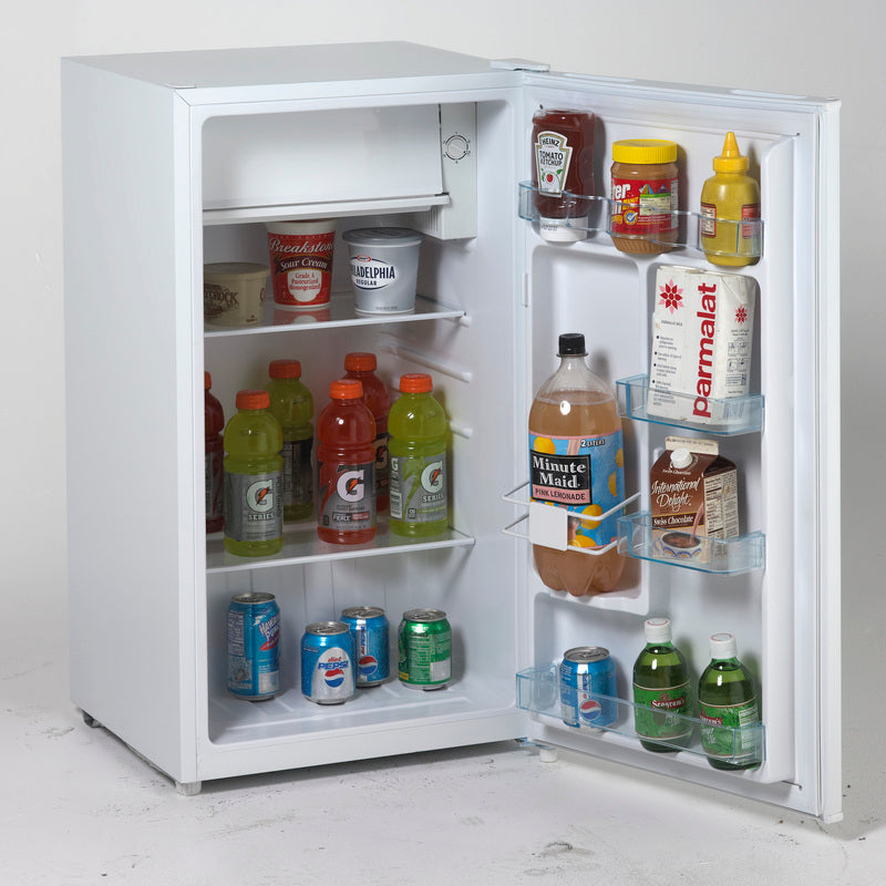 White compact refrigerator with chiller compartment, stocked with beverages and condiments from kitchen appliances collection