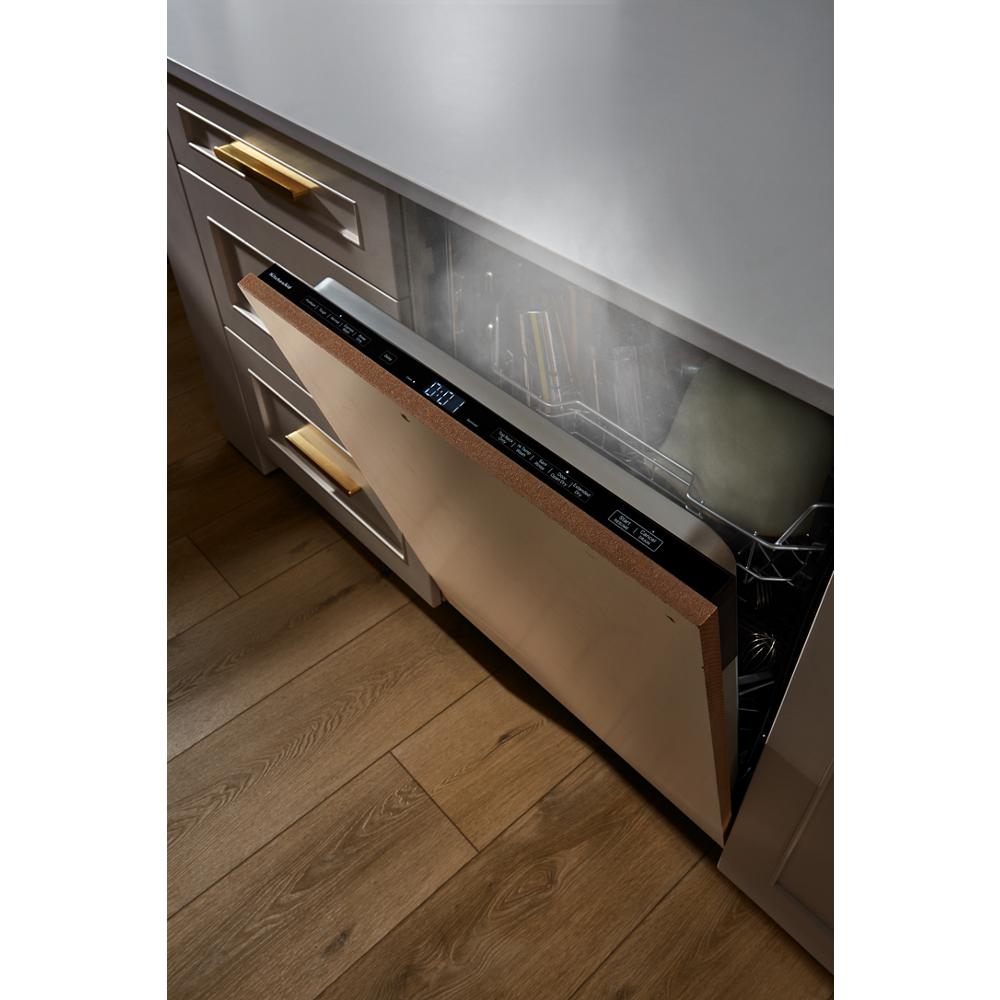 Panel-ready dishwasher with two racks releasing steam, integrated into kitchen cabinetry with brass hardware in appliances category