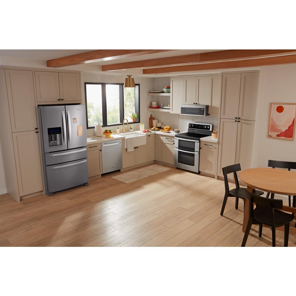 Modern kitchen featuring beige cabinetry, stainless steel appliances, including double oven electric range from ranges collection