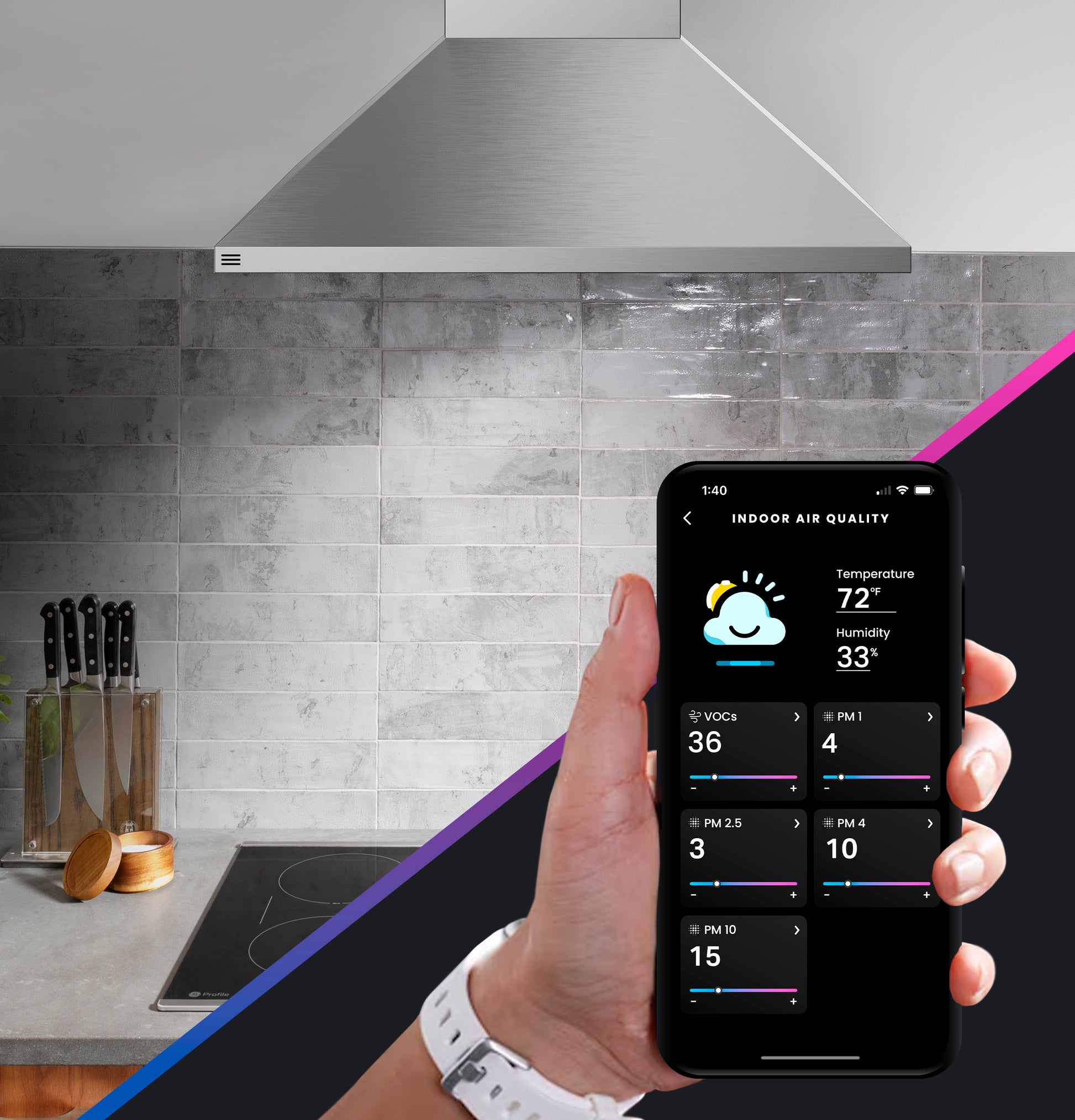 Stainless steel wall-mount pyramid vent hood above stove with a phone displaying indoor air quality readings