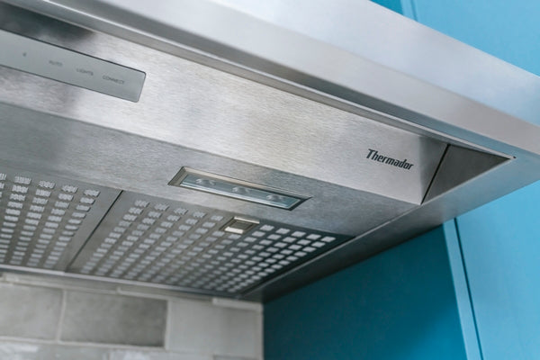 Stainless steel 36-inch custom insert range hood with noise control technology in kitchen appliances collection