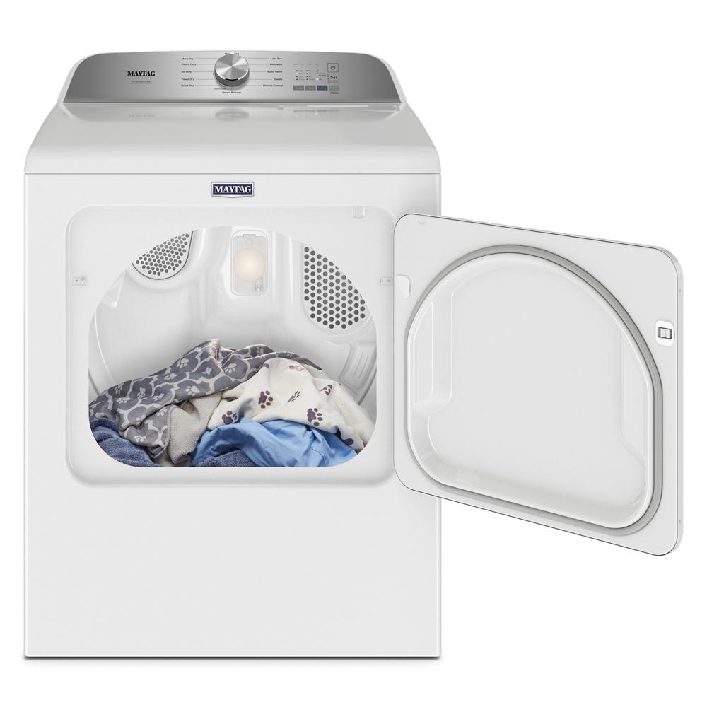 White electric top load dryer with open door showing clothes inside from Dryers collection