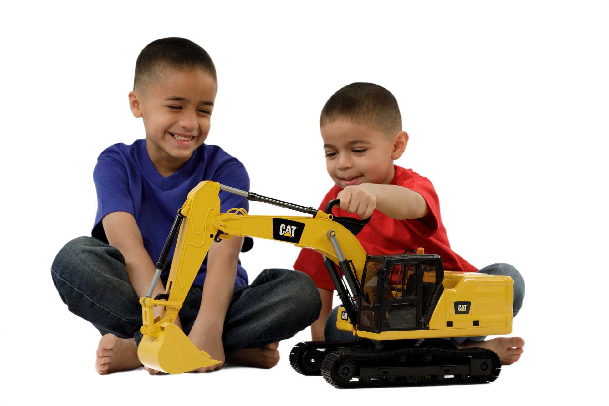 Two boys playing with a yellow Bruder 02484 CAT Excavator toy featuring movable arm and bucket on tracks