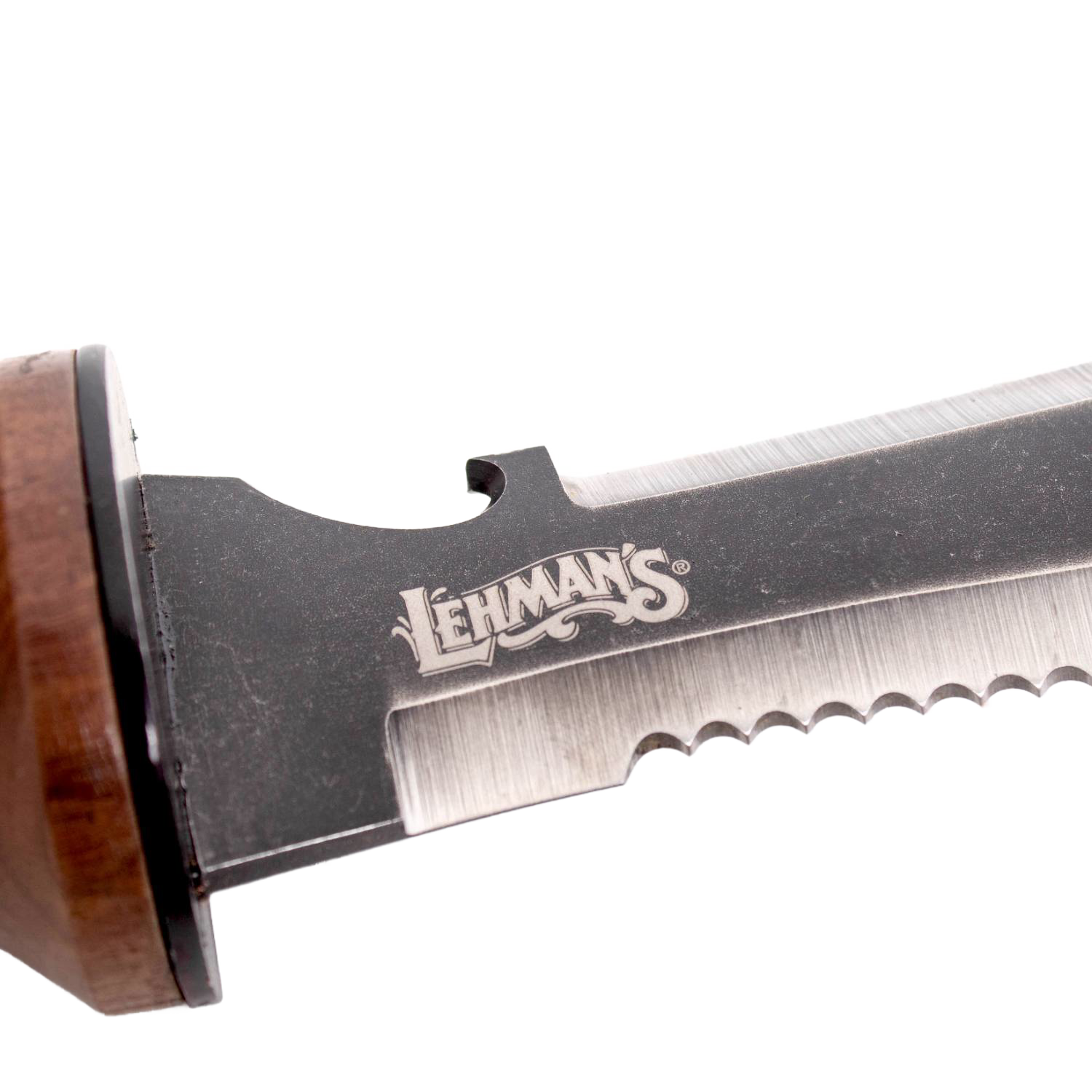 Close-up of serrated steel blade with wooden handle detail, part of a garden hand tool in outdoor and woodworking collections