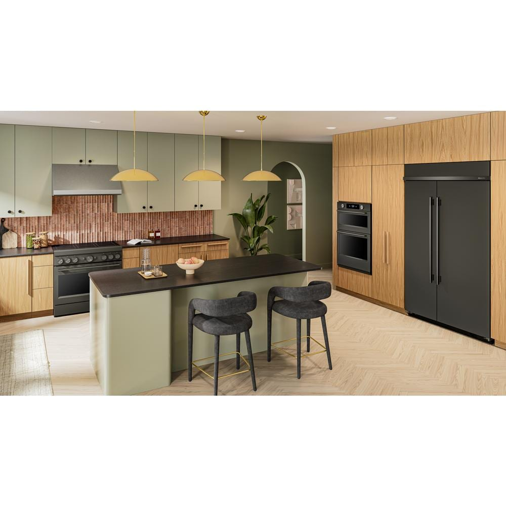 Modern kitchen featuring a black 36-inch induction range, built-in oven, wood cabinetry, and island with seating.