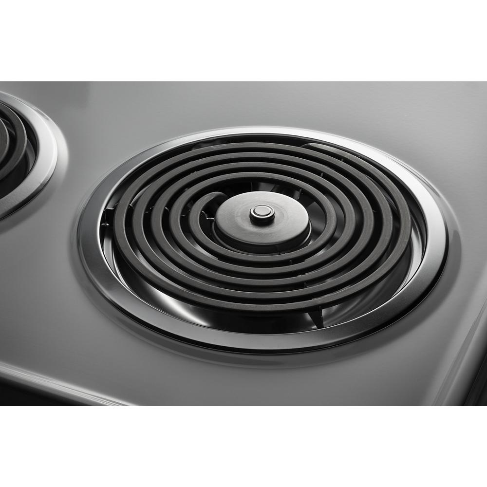 Close-up of black coil electric burner on smooth gray surface of 30-inch Amana electric range cooktop panel