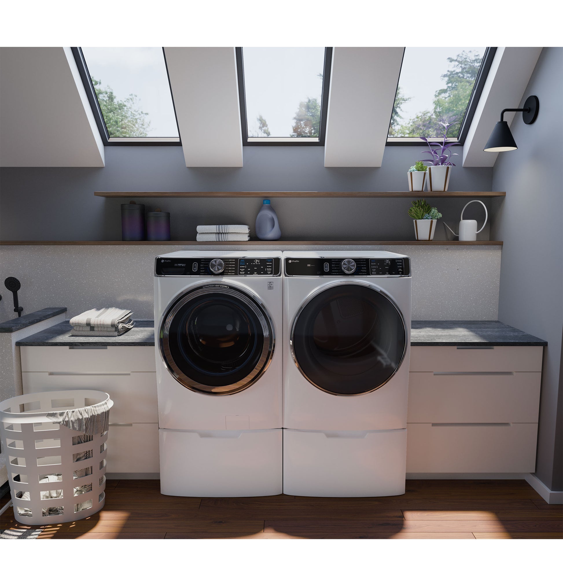 Modern white front load washer and dryer set in bright laundry room with skylights and built-in cabinetry from Dryers collection