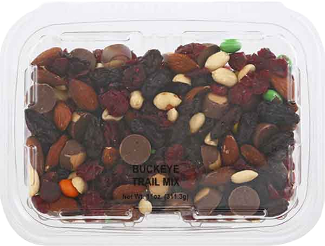 Clear plastic container filled with assorted trail mix featuring nuts, raisins, candies, and chocolate pieces from snacks collection