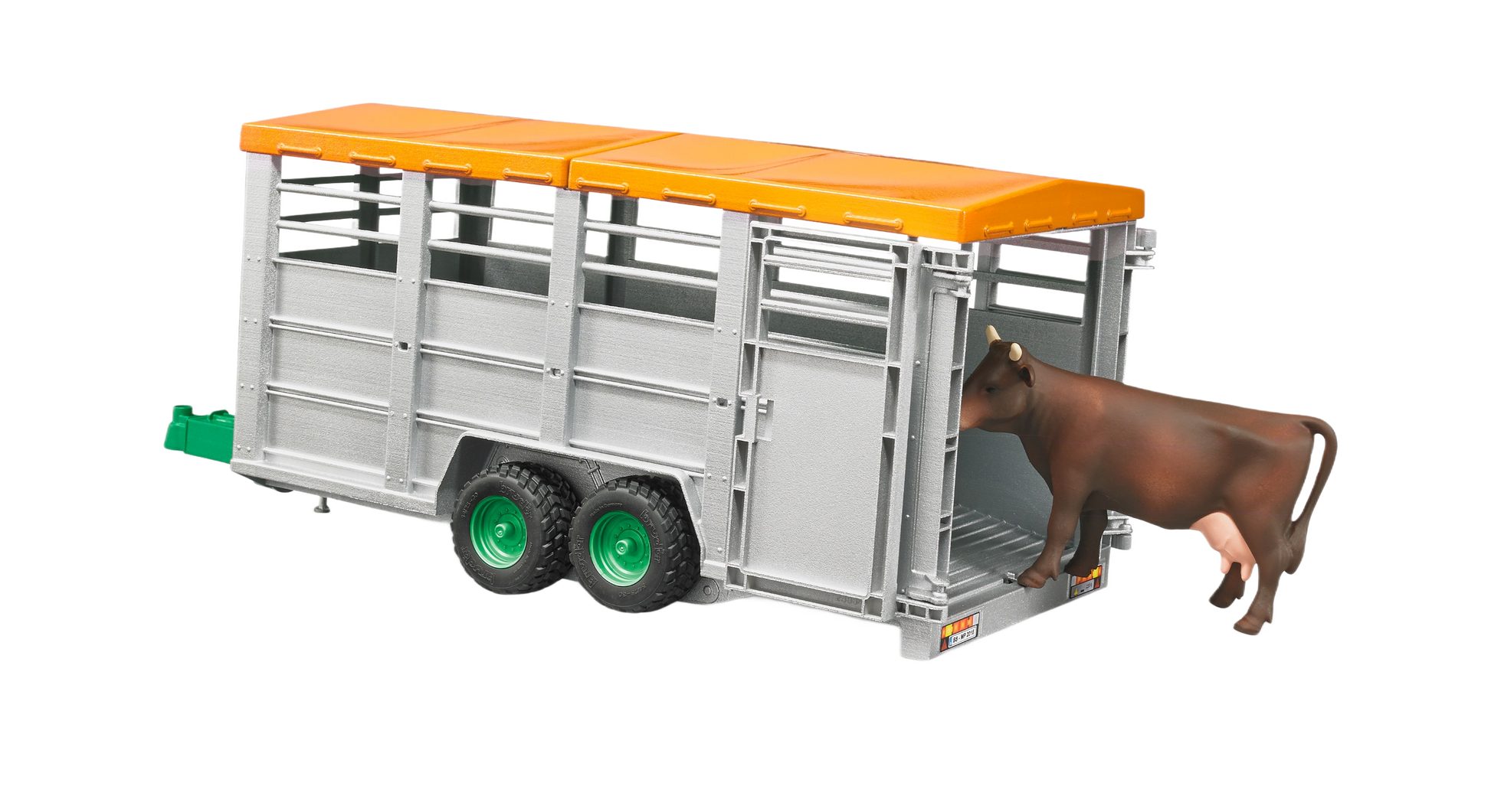 Gray toy livestock trailer with orange roof and green wheels, featuring a brown and black cow figure entering the back