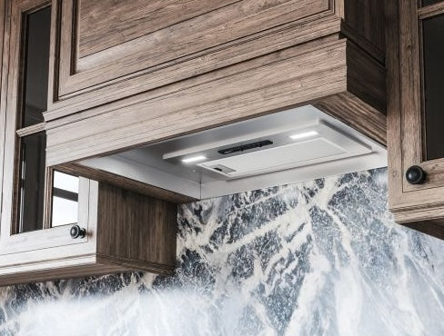 Compact under-cabinet energy-efficient hood with built-in LED lights and easy-to-clean filters for kitchen ventilation