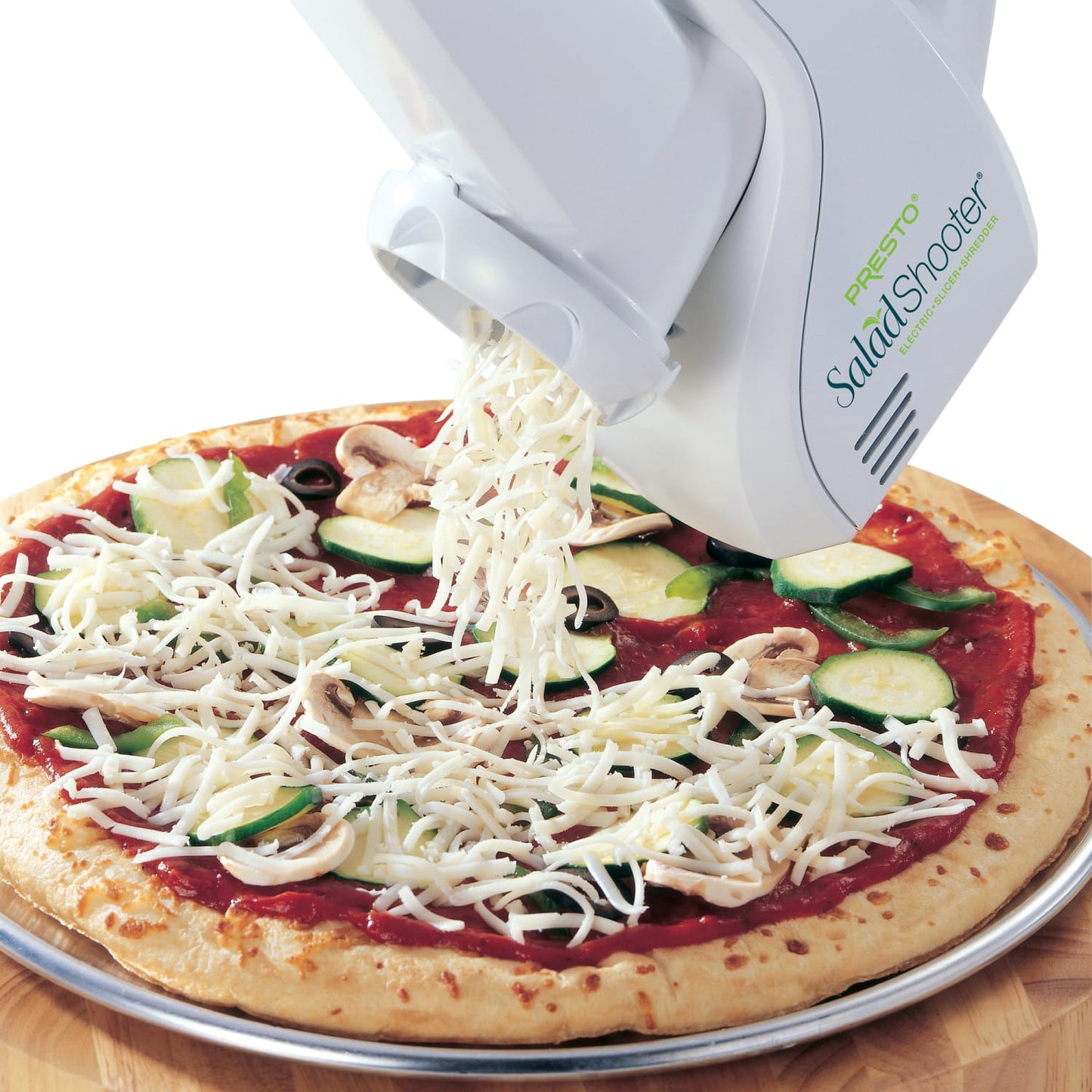 White and green electric slicer shredding cheese over vegetable pizza in kitchen gadgets under $100 collections
