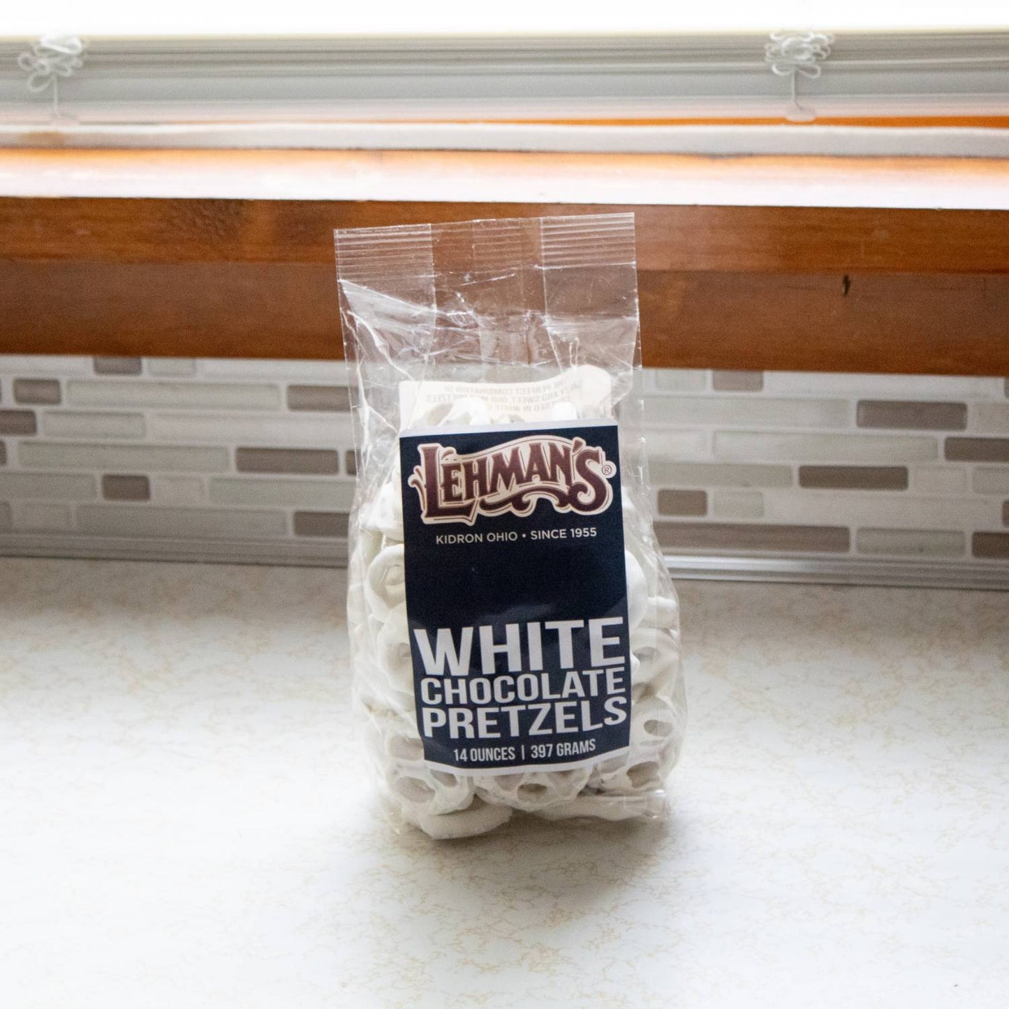 Clear bag of white chocolate covered pretzels from Chips & Snacks and Food & Beverage collections under $50
