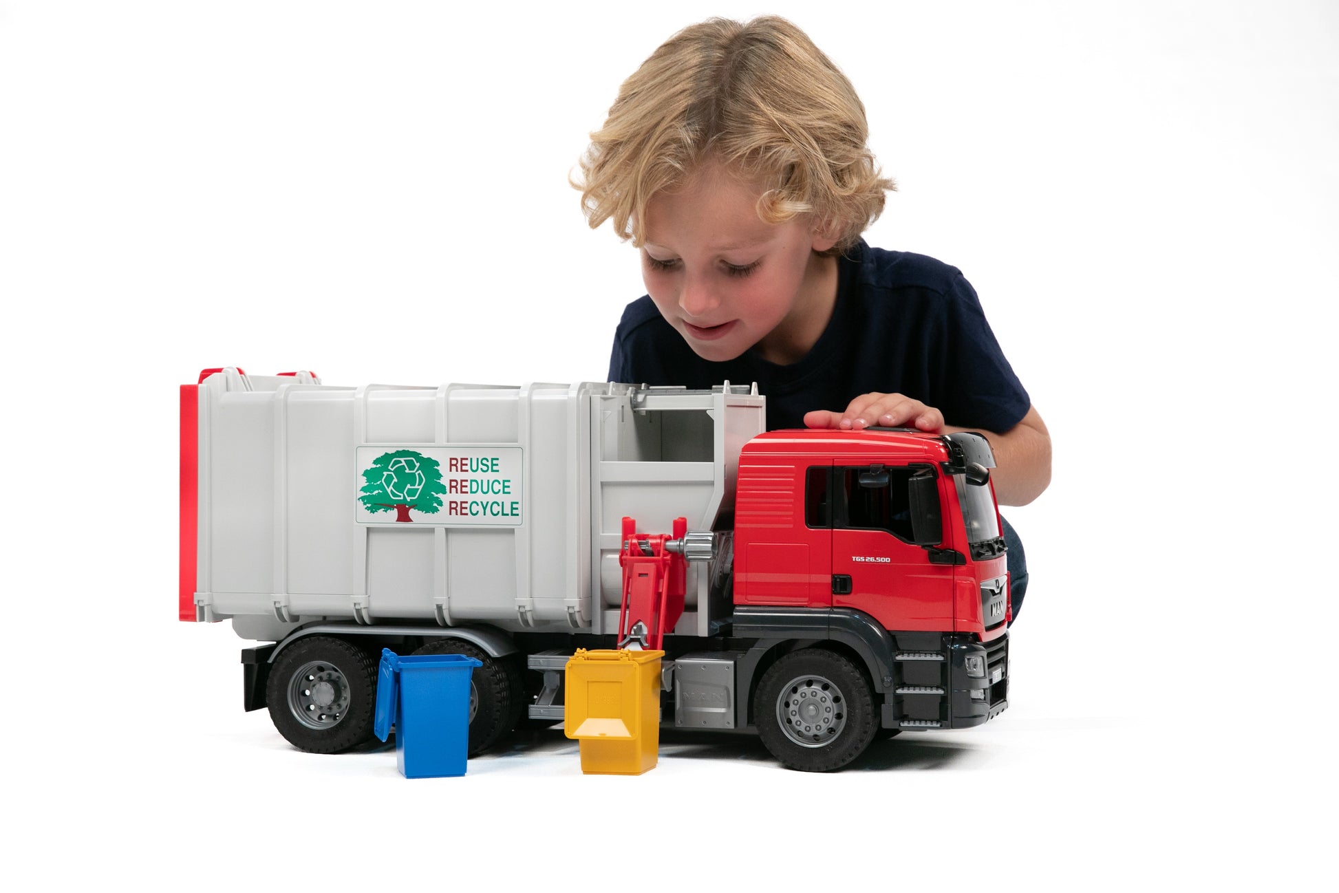 Child playing with a red and grey Bruder Man Tgs side loading garbage truck in Vehicles & Remote Controlled Toys collection