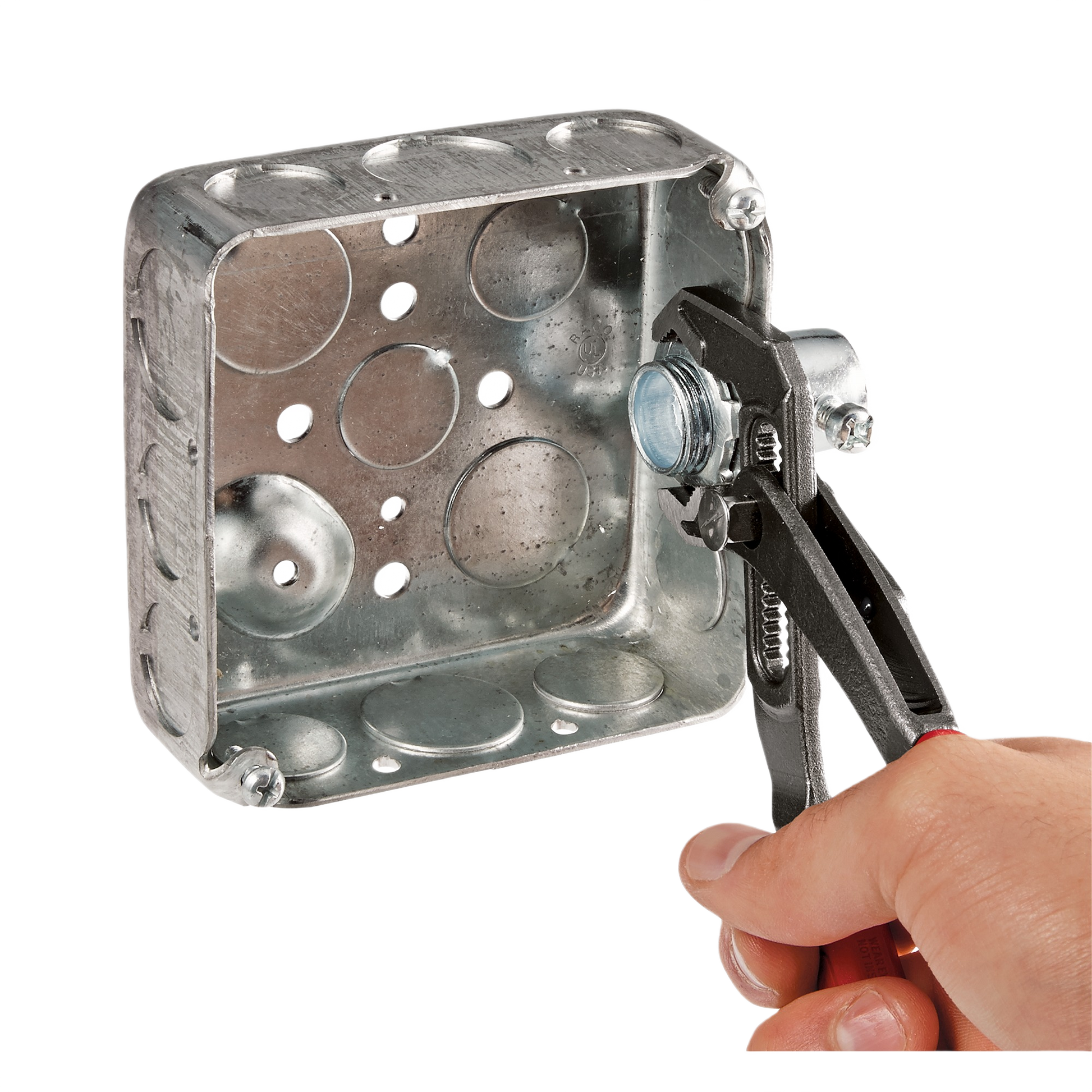 Hand using Milwaukee 10-inch comfort grip pliers to tighten a metal nut on electrical junction box for home improvement