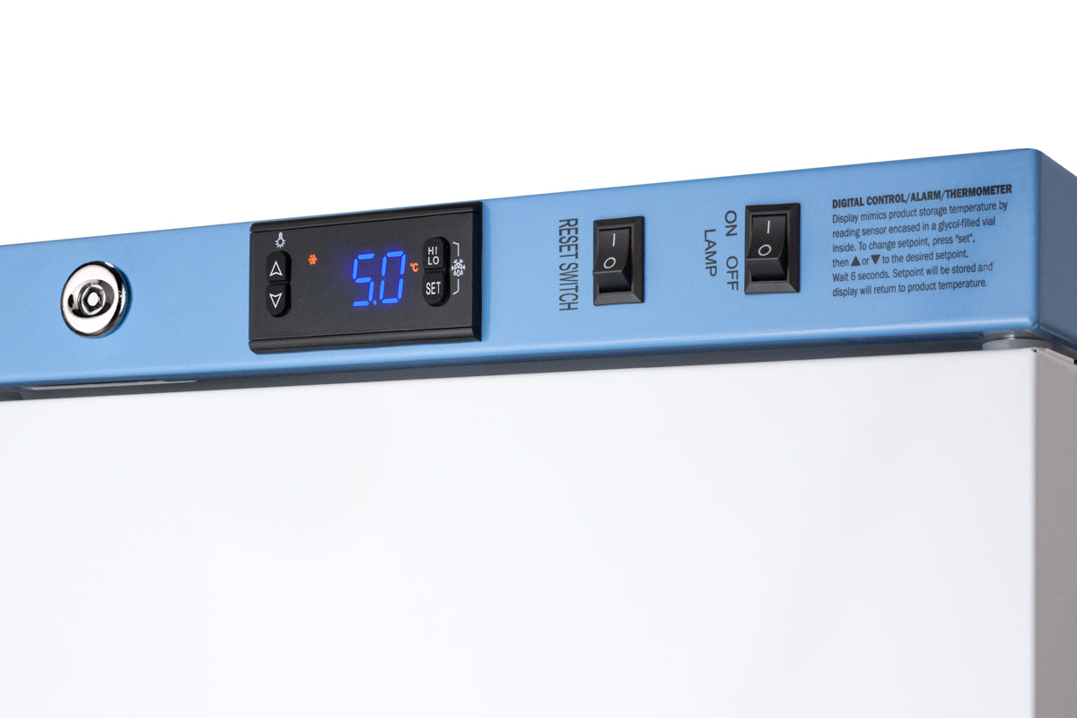 Close-up of blue control panel with digital temperature display and switches on a medical vaccine refrigerator