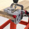 Metal and plastic self-clamping doweling jig with adjustable guide for precise woodworking and home improvement projects