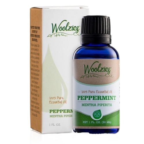 Blue glass bottle of peppermint essential oil with green and white label next to matching box in household items under $50