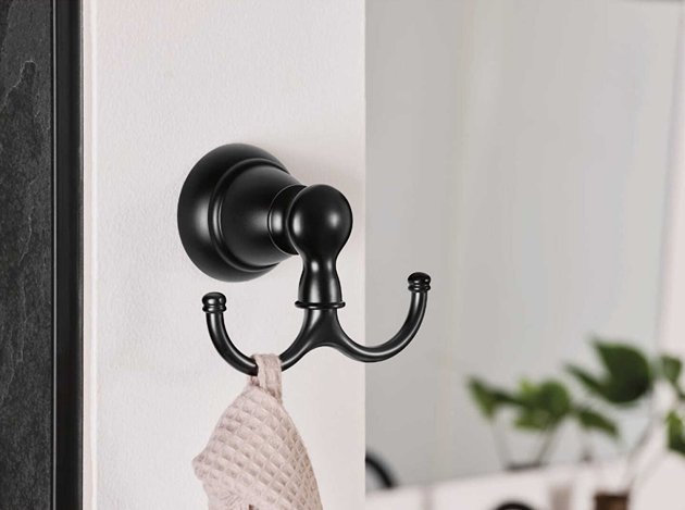 Matte black triple-prong wall hook with classic rounded design for bathroom and home organization projects