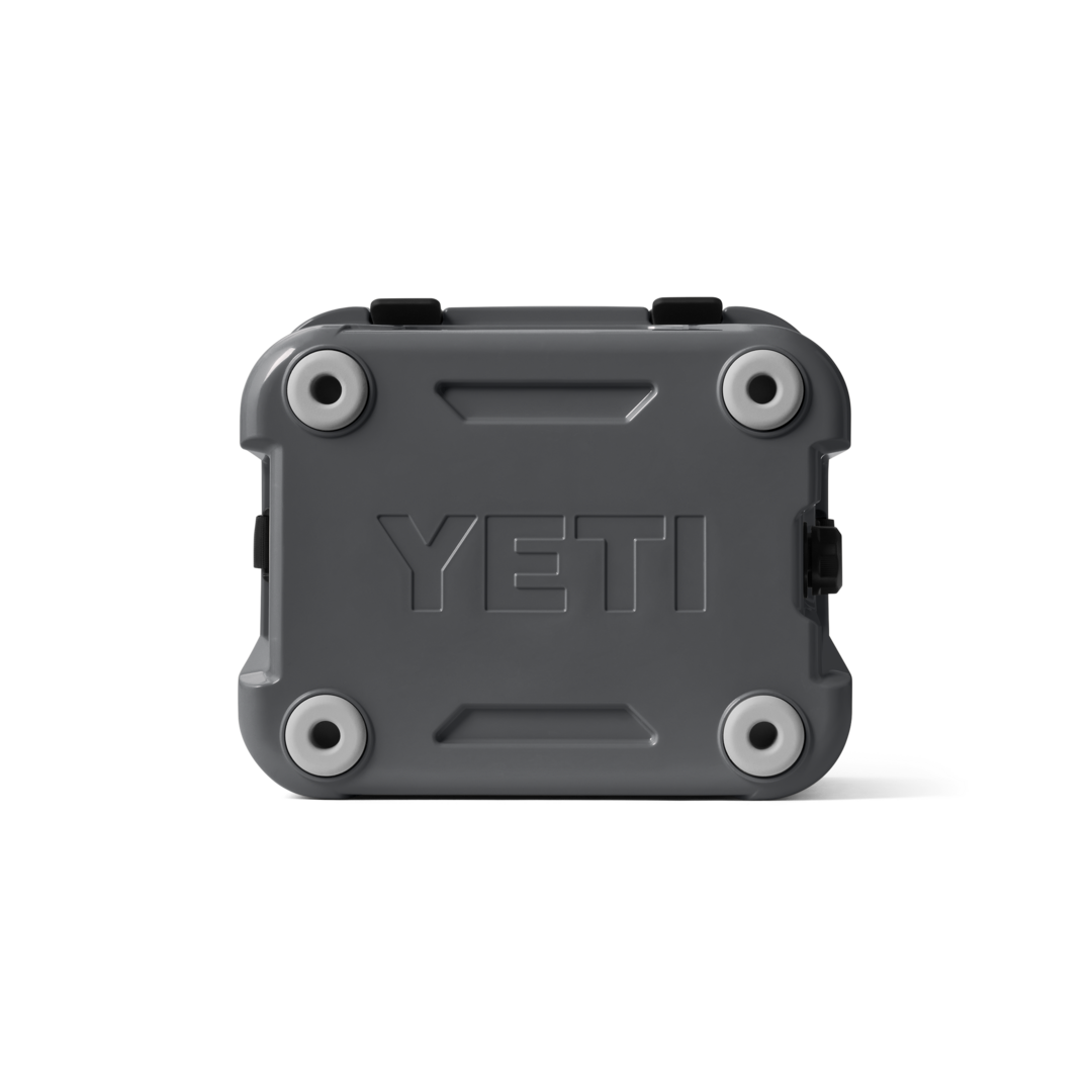 Gray durable YETI Roadie 24 cooler base with protective feet for food storage and outdoor organization collections