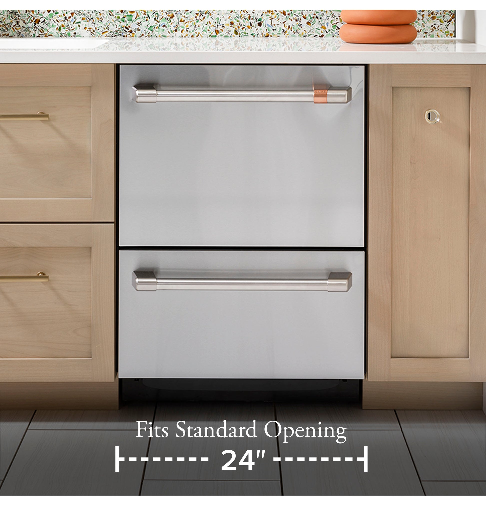 Built-in stainless steel double drawer dishwasher with modern handles installed in wood cabinetry for kitchen appliances.