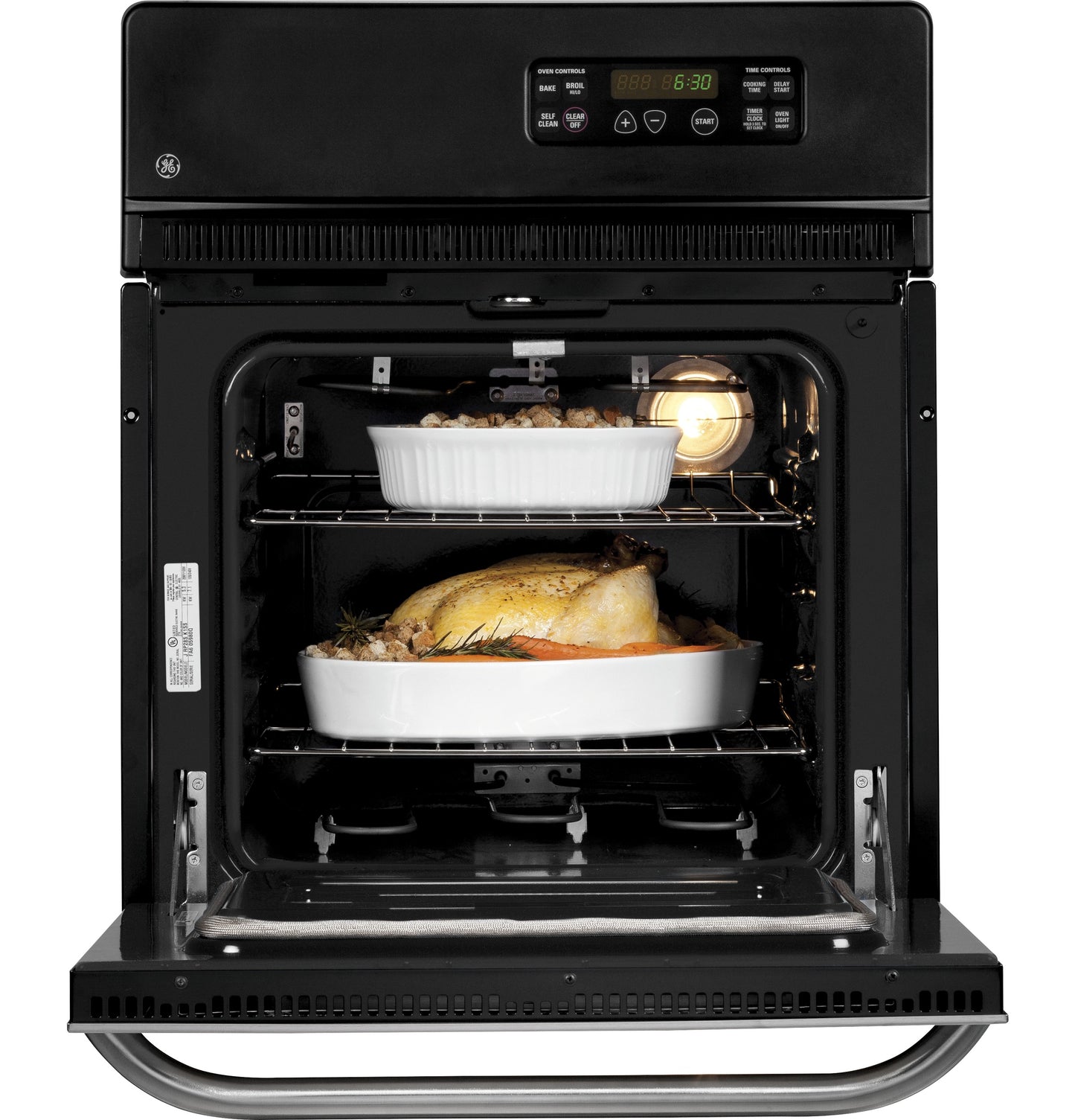 Black electric wall oven open with two white casserole dishes cooking food inside in Single Wall Ovens collection